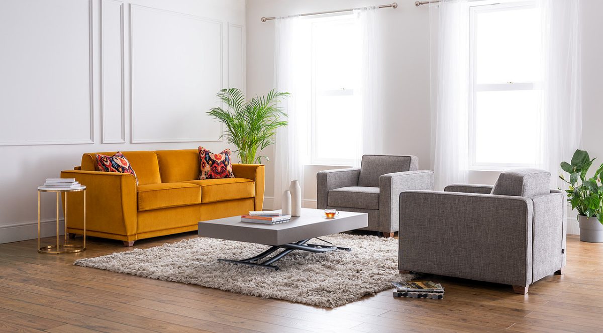 mustard coloured sofa bed in a living room